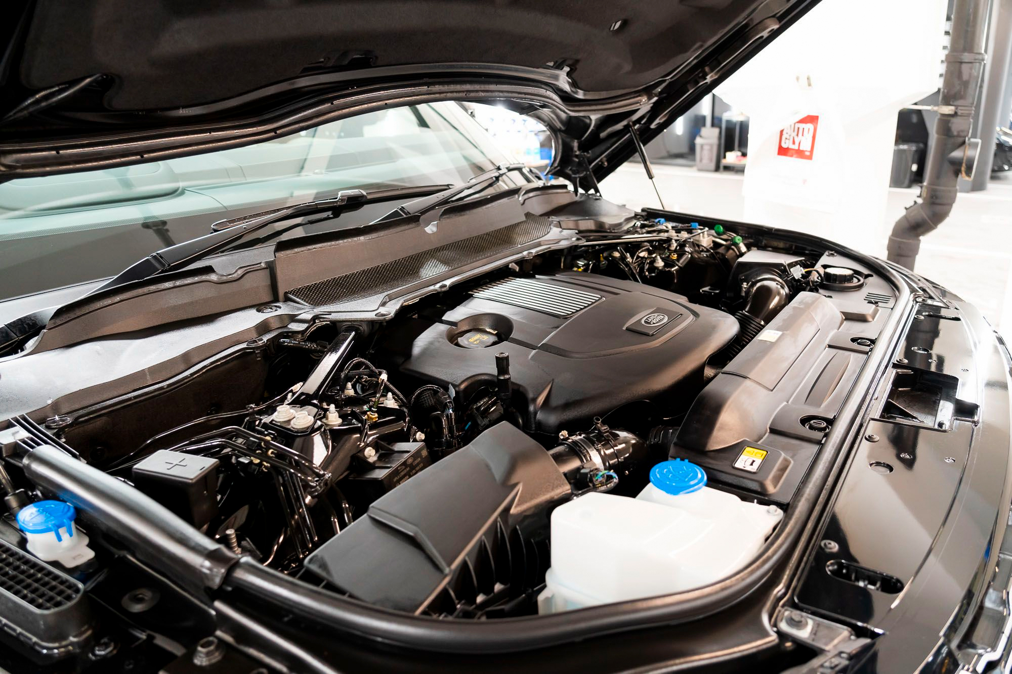 Open bonnet of a Land Rover showing the clean engine bay